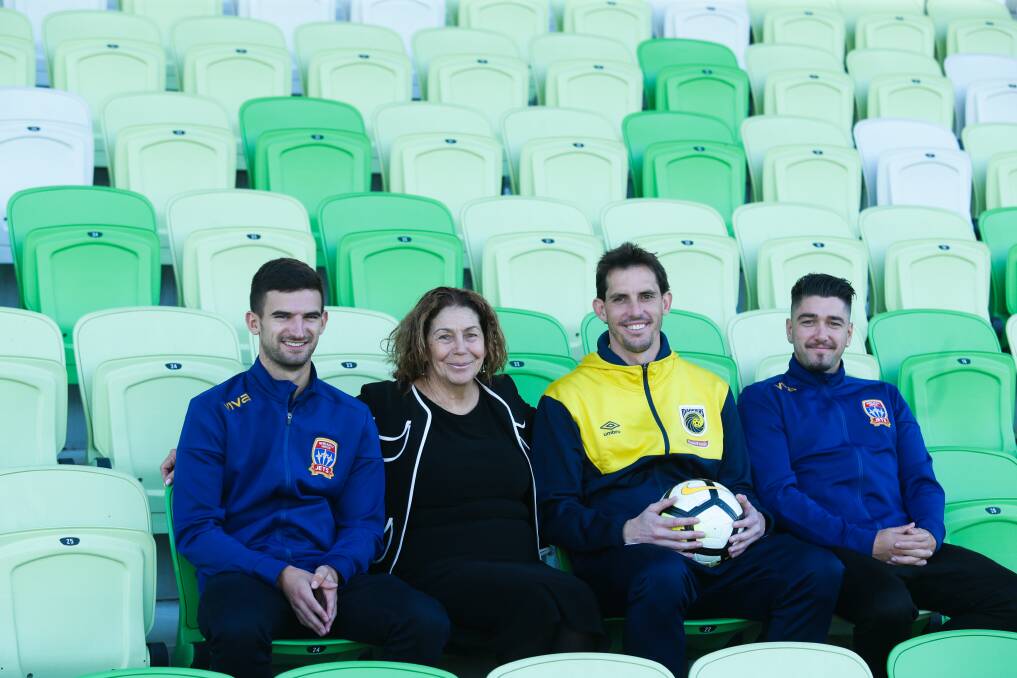 There will be an A League football/ soccer trial batch between the Central Coast Mariners and Newcastle jets at Maitland Sports Ground later this year. Picture shows Jets players Steven Ugarkovic, left, Dimi Petratos, Mariners player Ben Kennedy, third from left, and Maitland Mayor Loretta Baker, 2nd from left. Picture: Johnathan Carroll.