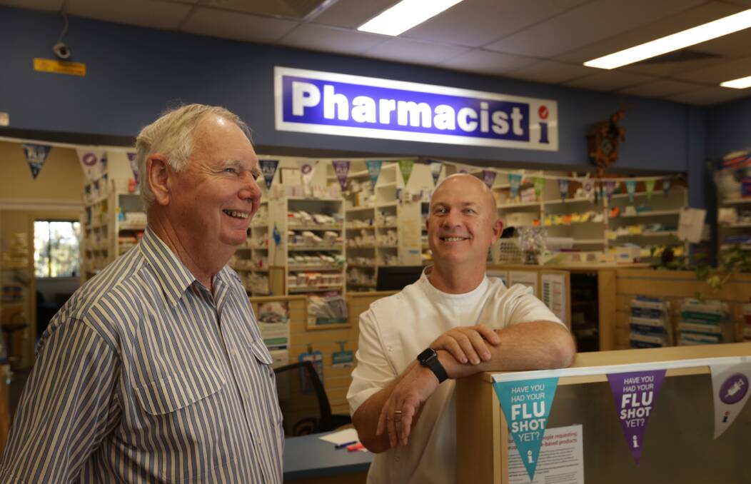 CHANGE OVER: After many years of ownership by David Buckley (left), Glenn Rose is now leading the team at Tenambit Pharmacy. Picture: Simone De Peak