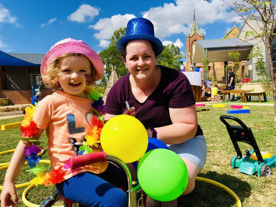 HAPPY: Amelia Wood, 3, and her mother Helen Noble at the first birthday celebrations. Picture: Catholic Care