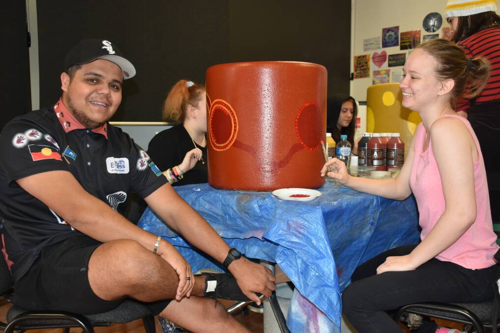 COMMUNITY-MINDED: Program coordinator Neville Marr and student Isabella Reid during one of the painting sessions.