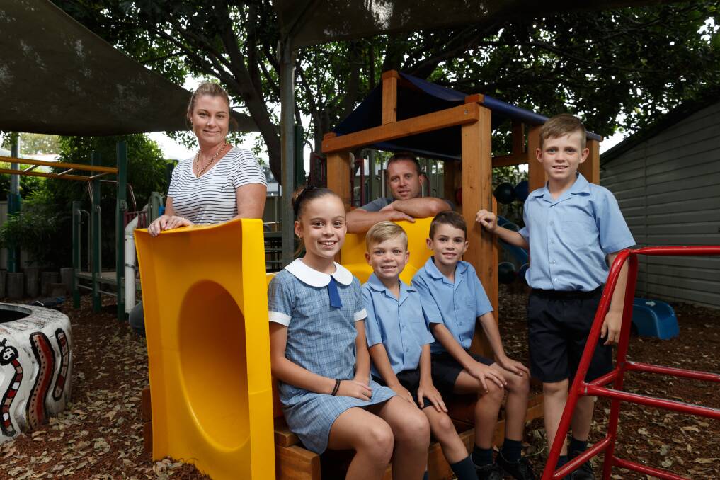 FUN TIMES: Monique and Andrew at Maitland Community Preschool with their four children (from left) Marissa, 11, Kye, 5, Jake, 7, and Luke, 9. Picture: Max Mason-Hubers