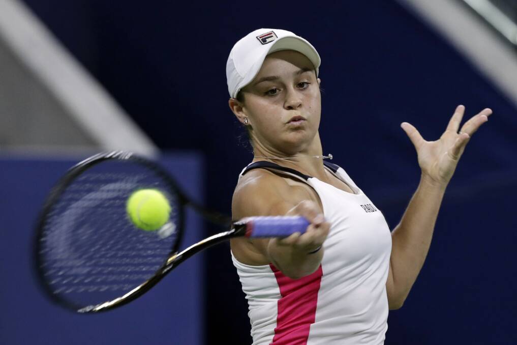 Ashleigh Barty returns a shot to Lauren Davis during the second round of the U.S. Open tennis tournament Wednesday. Picture: AP Photo/Adam Hunger