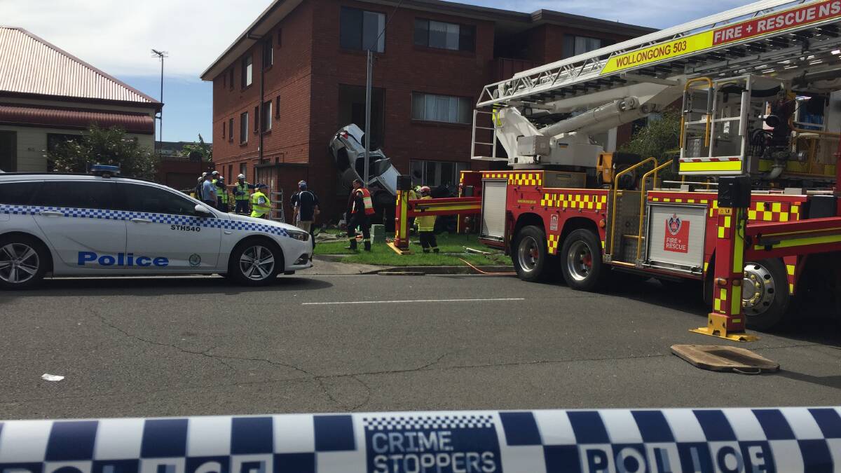 Cars somersault into Wollongong unit block in shocking high-speed crash
