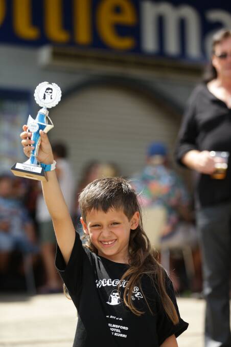 Western Australian Dean Singh shows of his trophy after winning the 4-7 year-old junior mullet award at Mullfest 2020 on Saturday. Pictures: Jonathan Carroll 