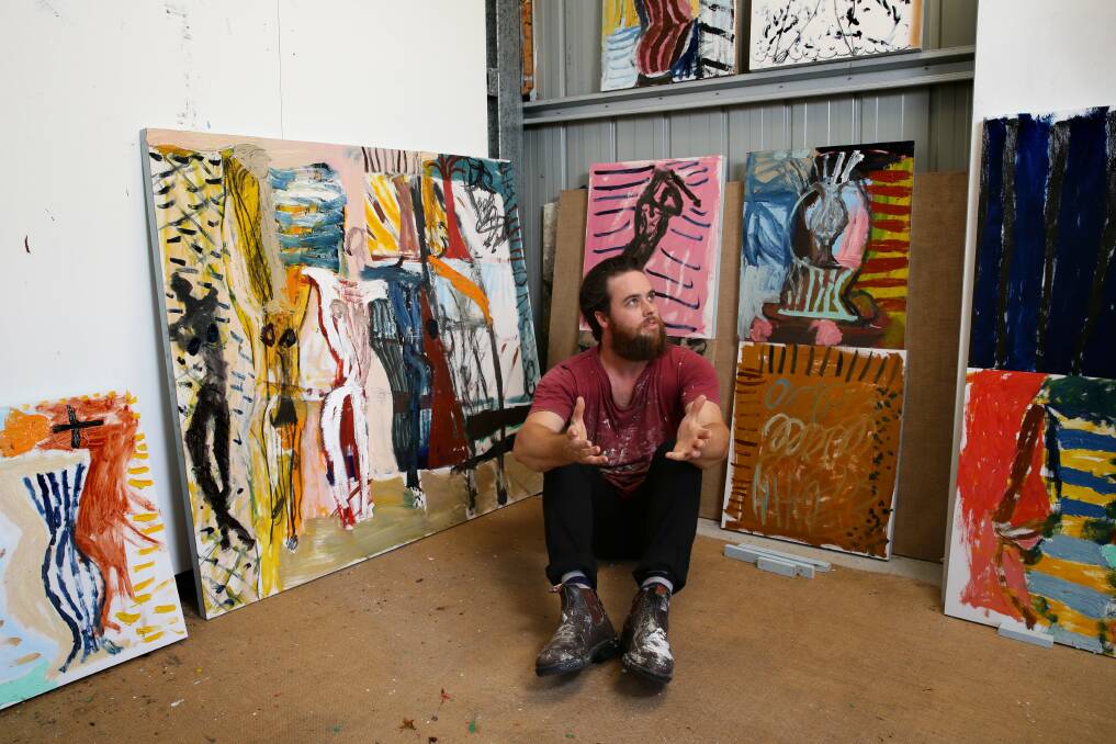 James Drinkwater surrounded by his paintings in his studio in 2016. Picture: Jonathan Carroll