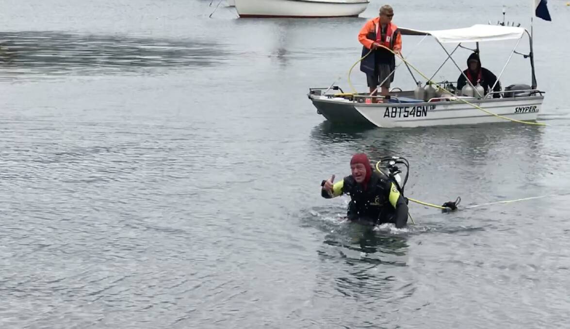 Rod Moore emerges from Sydney Harbour at Rushcutters Bay, after his underwater walk in 2018. Picture: Supplied 