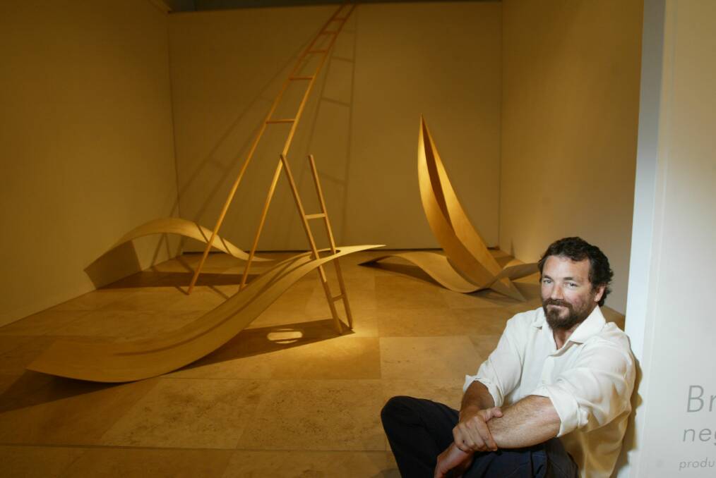 Braddon Snape with his sculpture, "Negotiating the Void", at Newcastle Art Gallery in 2004.  