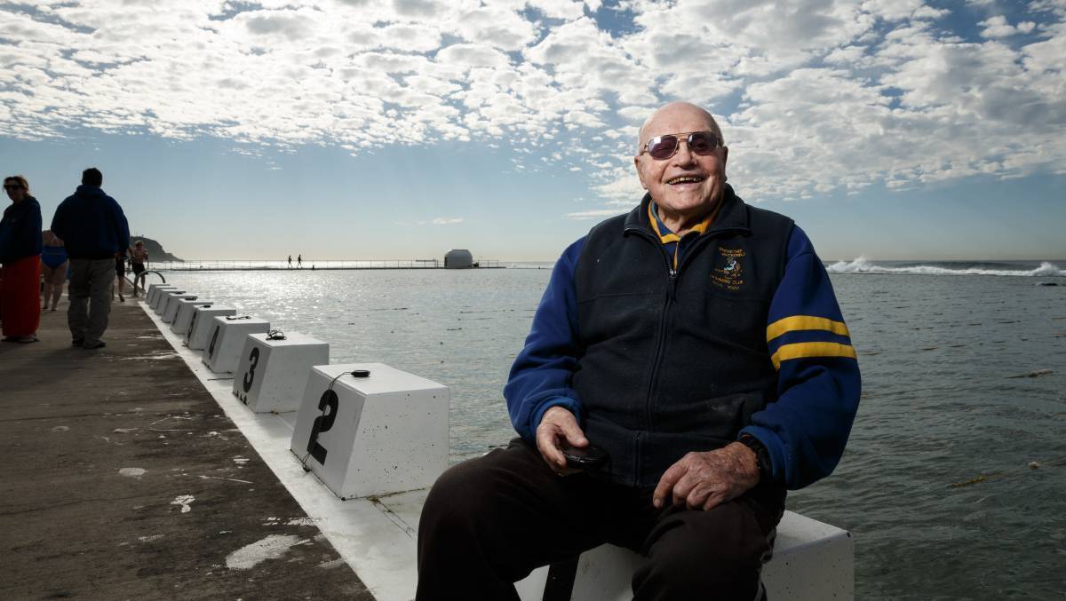 KEEPING TIME: Alf Carpenter sitting on the blocks at his beloved Merewether Ocean Baths, soon after he turned 100. 