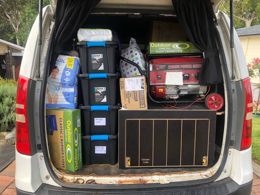 LOTS OF CARE: One of the vans loaded with donated items. Picture: Matt Forde 