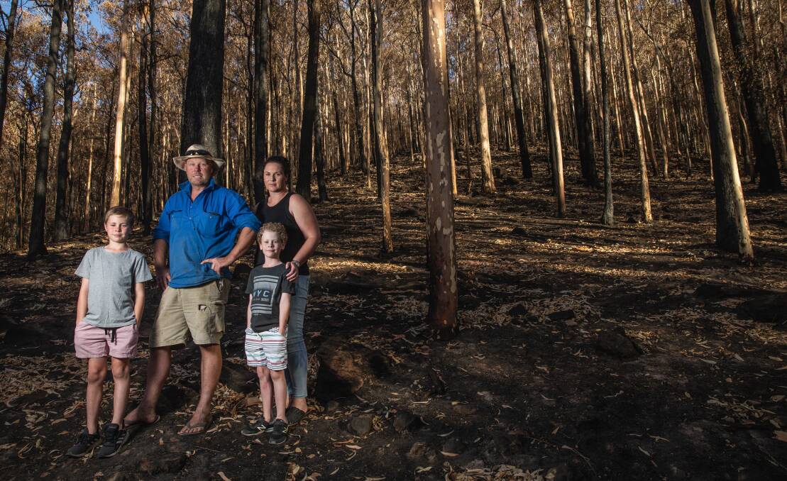 The Eddy family in the forest behind their home. Picture: Marina Neil