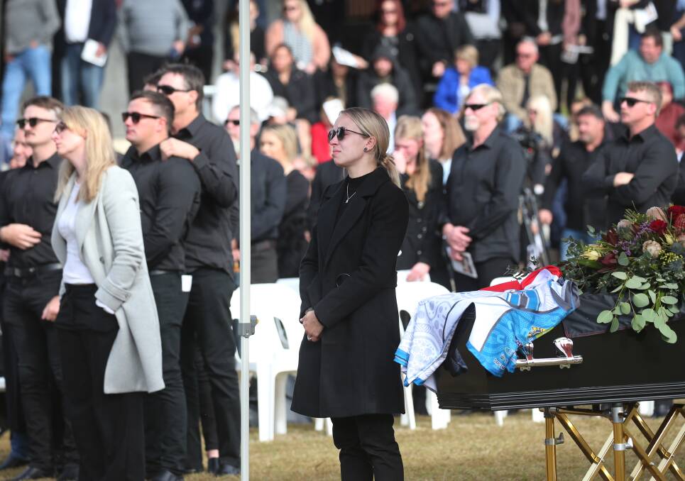 GRIEVING: Amani Ping, Ben Langdon's fiancee, at the service, near the jersey-draped coffin. 
