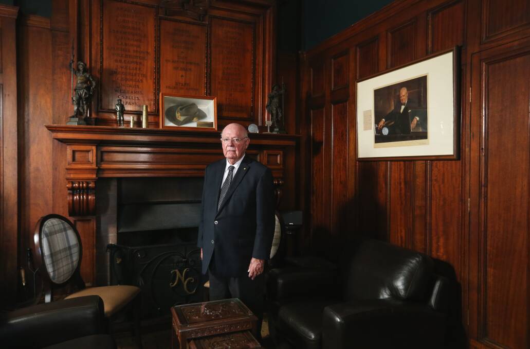 Professor Ken Dutton in the coffee lounge, with the roll of honour behind him. Picture: Marina Neil