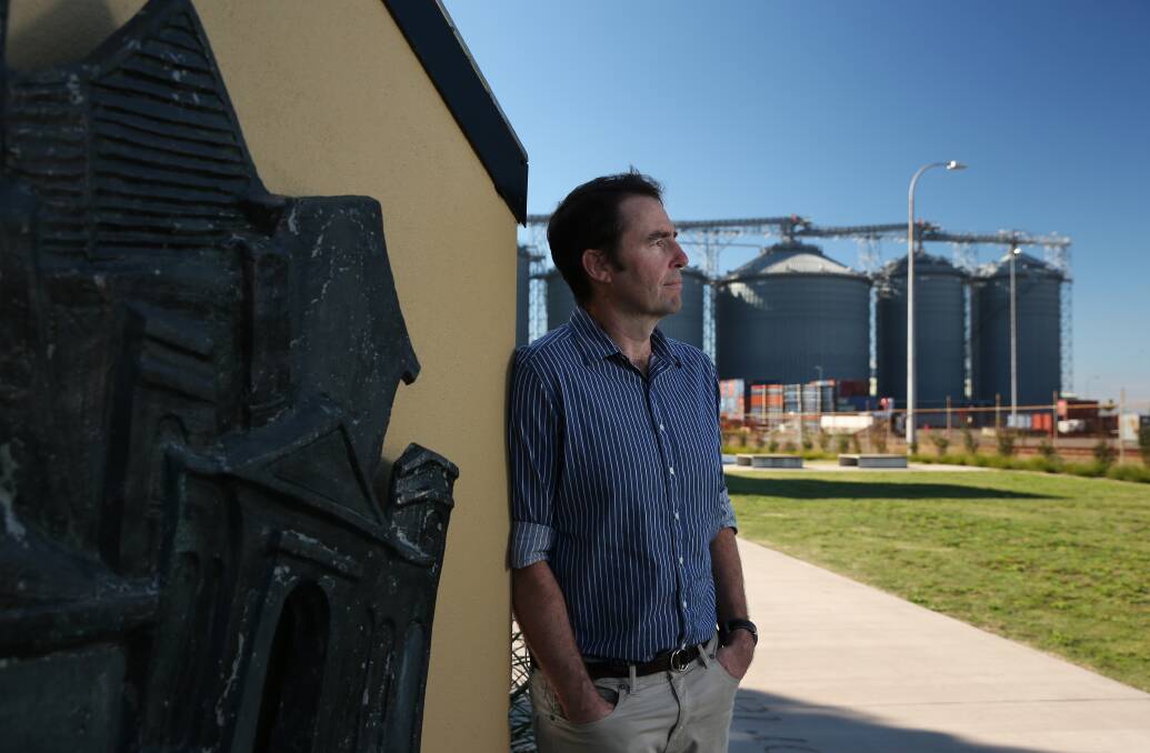 Jock Carter, co-CEO of grain logistics company Newcastle Agri Terminal, with the silos at Carrington. Picture: Simone De Peak