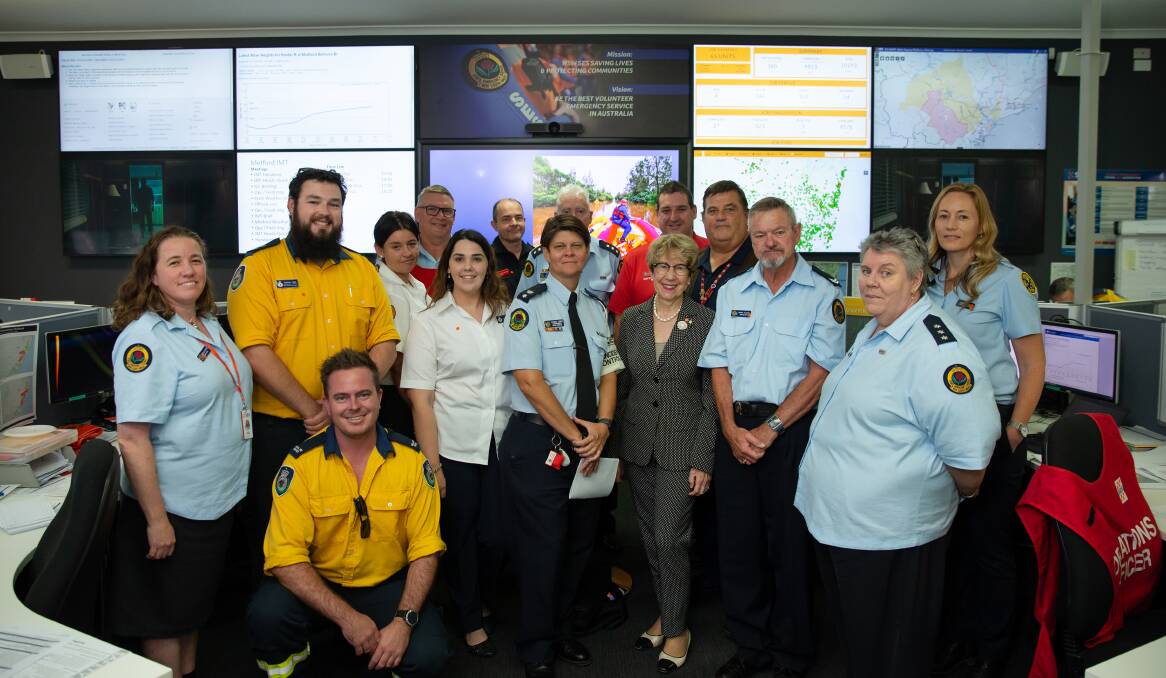 The NSW Governor, Margaret Beazley, with emergency services workers at the SES headquarters in Maitland. Picture: Marina Neil