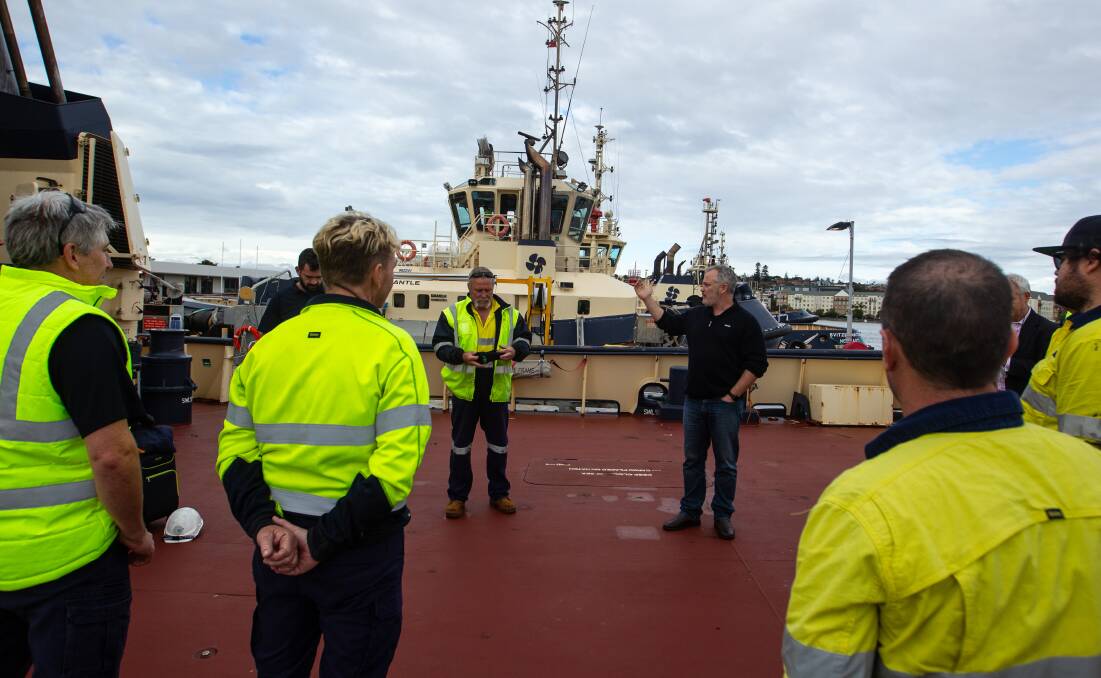 Geophrey Gavin, Svitzer's Newcastle Port and Operations Manager, speaks with the crew of the "Svitzer Glenrock". Picture: Marina Neil 