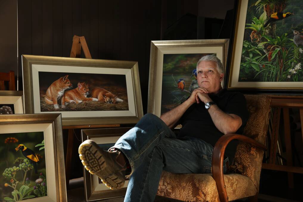 Artist James Hough in his home studio, surrounded by some of his paintings. Picture: Simone De Peak
