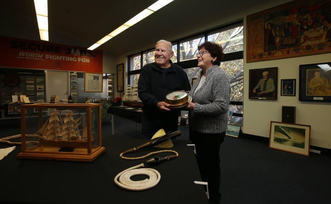HISTORY: Retired seafarer Tom Jones and Lynda Forbes hold a telegraph, which is on display at the exhibition commemorating 150 years of the Maritime Union of Australia. Pictures: Simone De Peak 