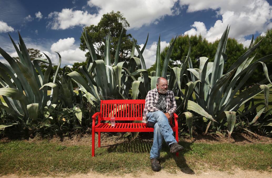 GARDEN ART: Dale Frank sits in the botanical gardens he has created on his historic property near Singleton. Pictures: Simone De Peak 