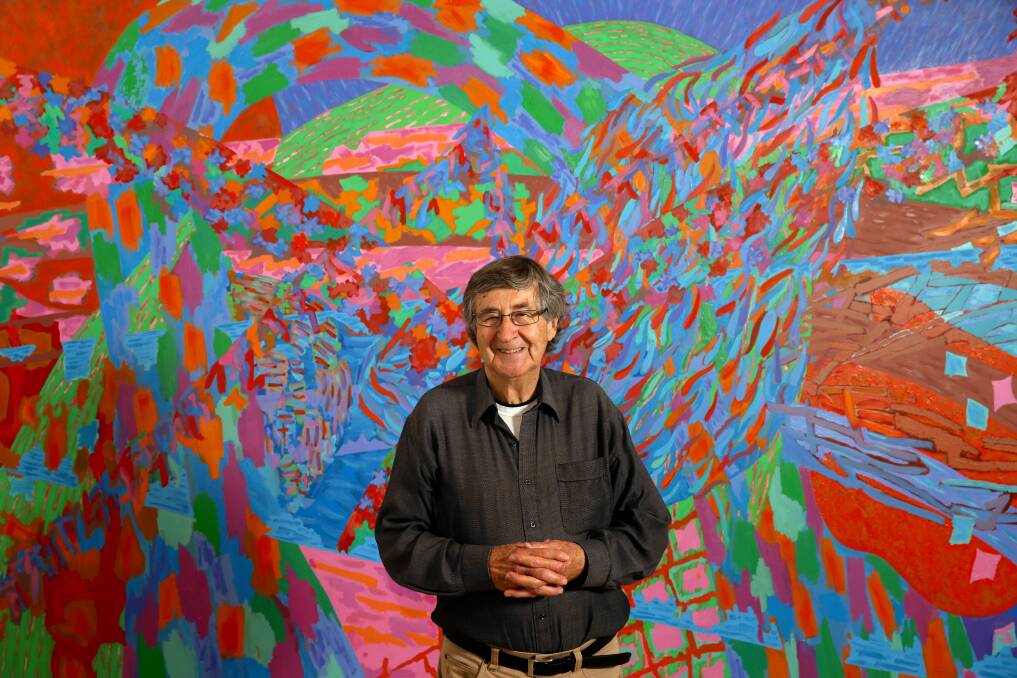 COLOURFUL: Former director David Thomas standing in front of a Virginia Cuppaidge painting at Newcastle Art Gallery, before delivering a lecture about the gallery's evolution on Friday night. Picture: Jonathan Carroll