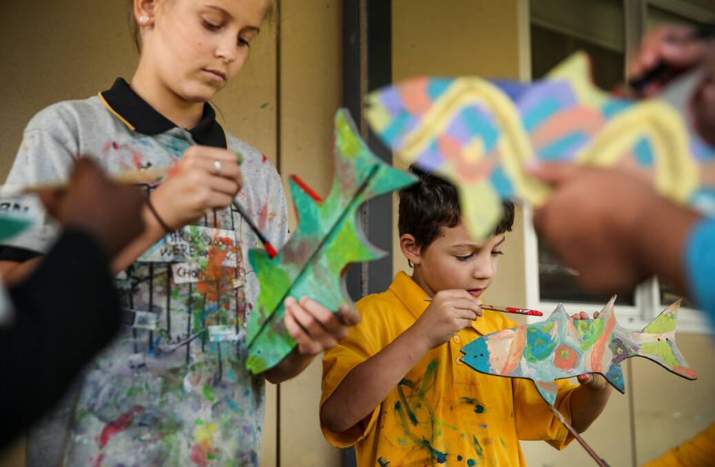 A community project to combat plastic pollution has become a "Mullet Revolution", as everyone from the public school to local businesses display brightly coloured fish stencils. Pictures: Marina Neil  