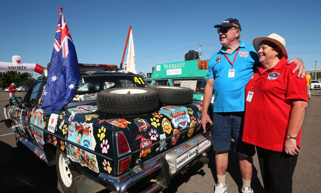 DRIVEN COUPLE: Gary Adams and Elaine O'Hearn with their entry, Paw Patrol.
