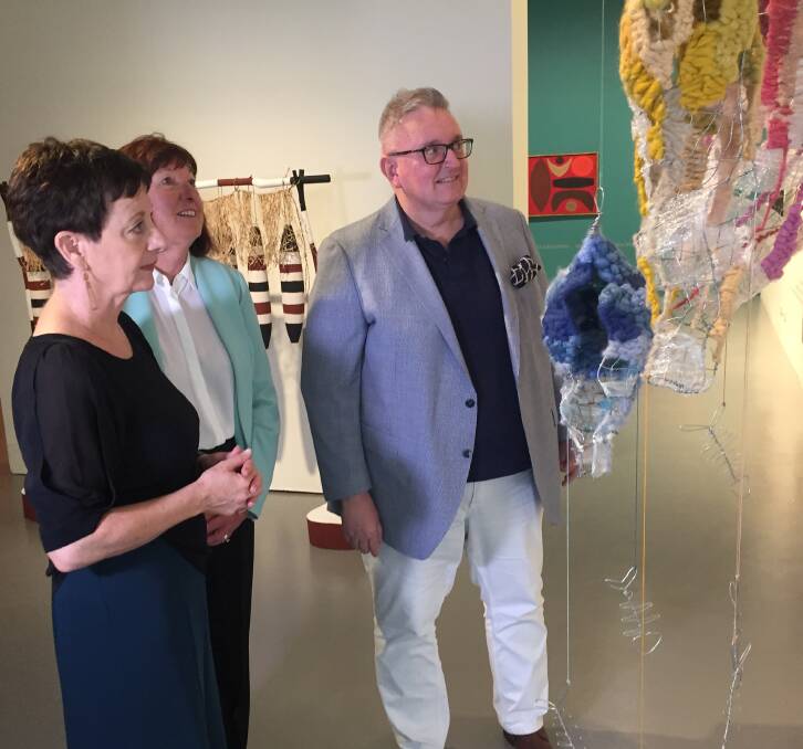 VIEWING: Director of Museum of Art and Culture, Debbie Abraham, Lake Macquarie mayor Kay Fraser, and NSW Arts Minister Don Harwin at the redeveloped gallery. Picture: Scott Bevan
