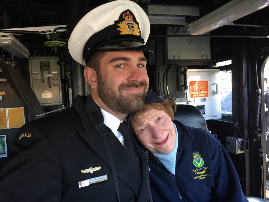 Sub Lieutenant Matthew Newman with Margaret McNaughton on board HMAS Newcastle. Picture: Scott Bevan 