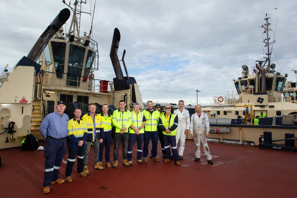 The crew of the "Svitzer Glenrock" on the tugboat's deck. Picture: Marina Neil