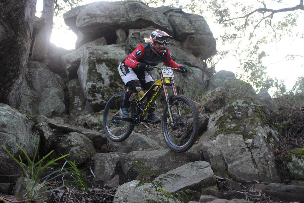 Coleen Kehoe, from Hunter Mountain Bike Association, rides the 'rock garden' at the Awaba park. Picture: Courtesy, Tyson Richens, Hunter Mountain Bike Association