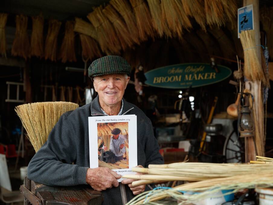 John Wright with his book in his renowned broom-making shed. Picture: Max Mason-Hubers 
