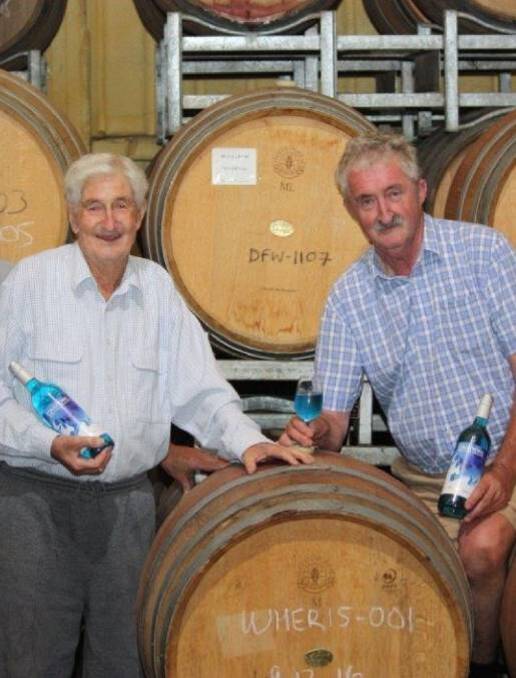 TRADITION: John Drayton, right, with his late father, Max, in the family's winery at Pokolbin.