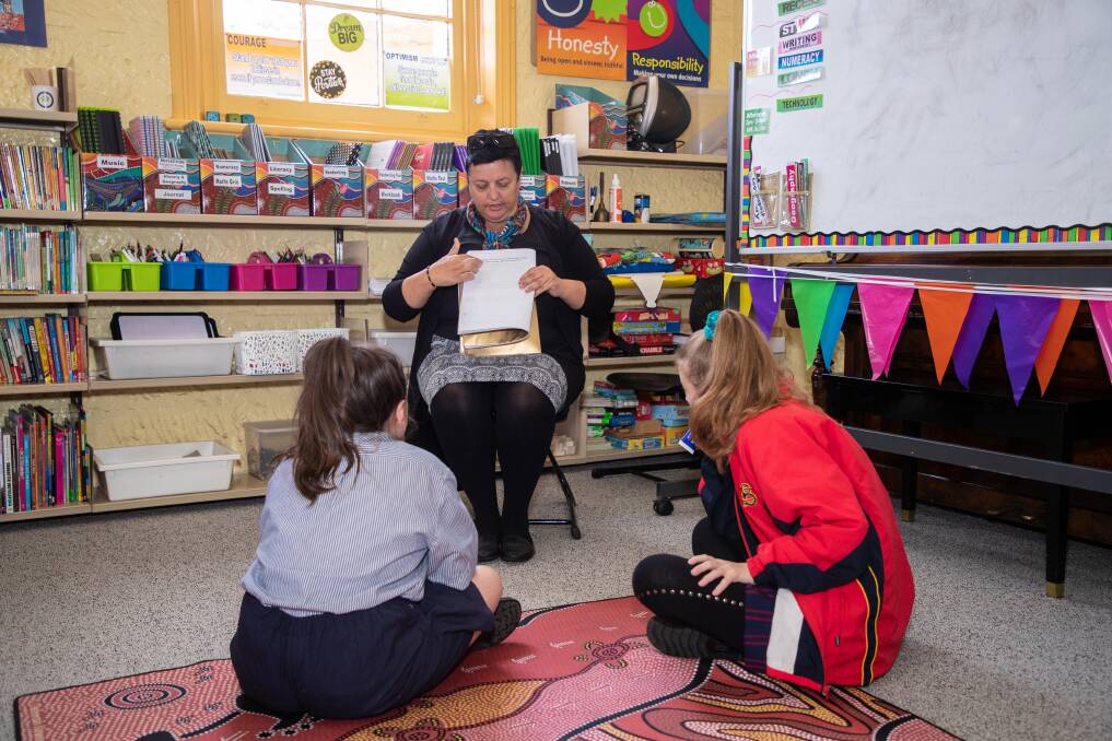 LEARNING: Teacher Mandy Shaw with two students at Ngarralingayil Barker school. Picture: Supplied