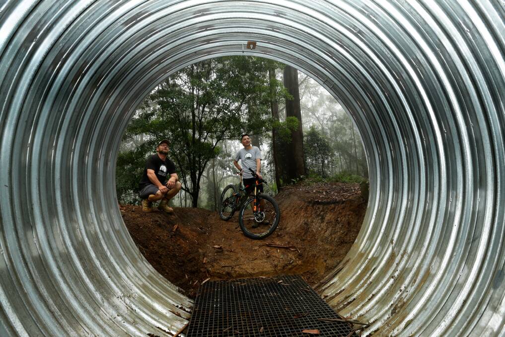 Rick Kehoe and Dallas Barham inspect the tunnel near the start of the new trail. Picture: Jonathan Carroll