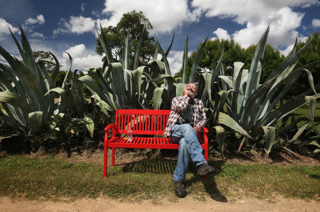 Dale Frank sits in the botanical gardens he has created on his historic property near Singleton. Picture: Simone De Peak 