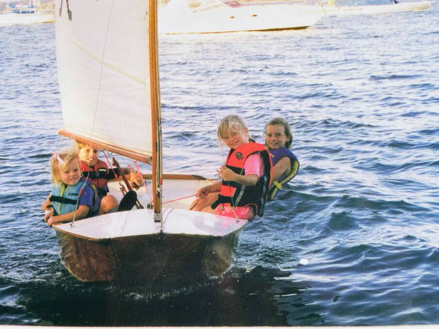 EARLY DAYS: Will Ryan, second from left, in the family sabot with sisters Elise, Jaime and Sasha on Lake Macquarie. Picture: Courtesy, Ryan family 