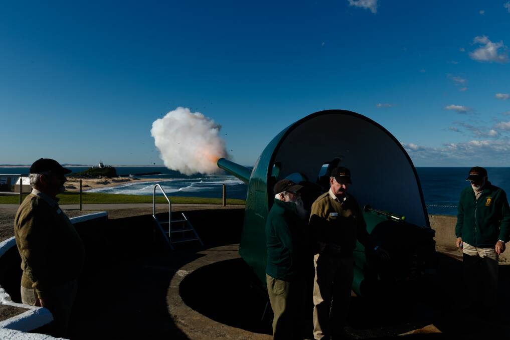 One of Fort Scratchley's guns is fired to commemorate the 80th anniversary of the Japanese submarine attack on Newcastle. Picture: Max Mason-Hubers