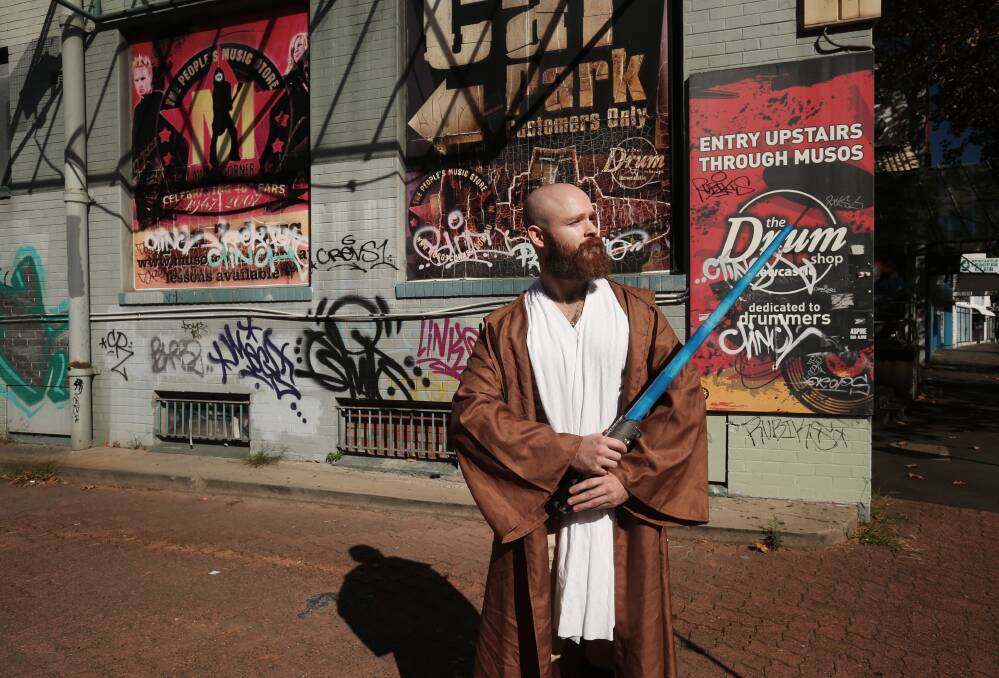 Nathan Field preparing for the "May the Fourth Be With You" sale at Musos' Corner. Picture: Simone De Peak