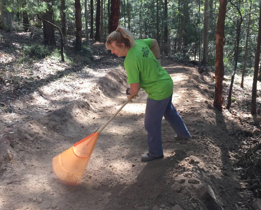 Coleen Kehoe working on a trail at the Awaba Mountain Bike Park in 2019. Picture: Scott Bevan