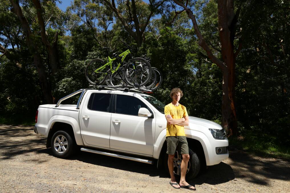 TOLL ON TOP: Tim Haasnoot with his ute and bikes on the roof, which has led to higher charges for him on Sydney toll roads. Picture: Jonathan Carroll 