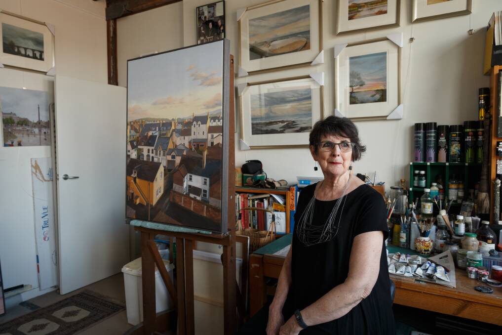 ART TRAVELS: Kerrie Coles in her home studio, with her painting, "Llandudno, Wales", on the easel. Picture: Max Mason-Hubers