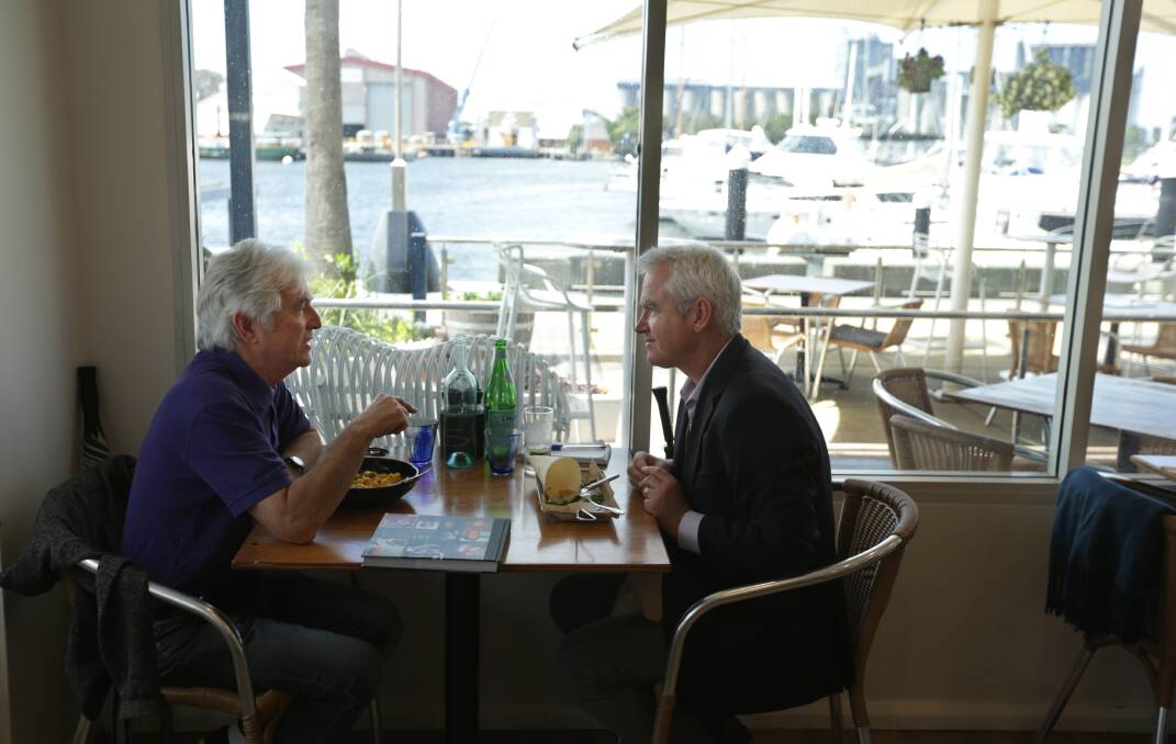HARBOUR VIEW: Artist and writer Gavin Fry at lunch in his "home port" with Scott Bevan. Picture: Simone De Peak