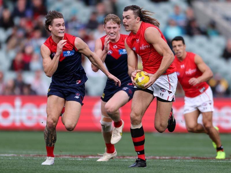 Sam Draper (right) kicked three goals as Essendon upset Melbourne by 27 points at Adelaide Oval. (Matt Turner/AAP PHOTOS)