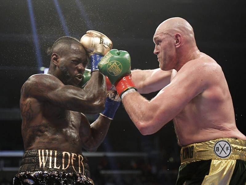Tyson Fury's first fight with Deontay Wilder (left) a year ago ended in a controversial draw.