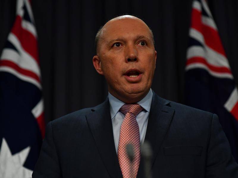 Peter Dutton has called for laws to stop Australians with suspected terror links from returning home