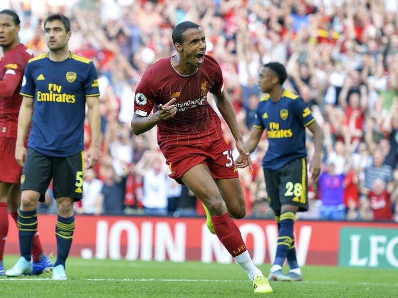Joel Matip (C) has helped Liverpool maintain their perfect EPL start with a 3-1 win over Arsenal.