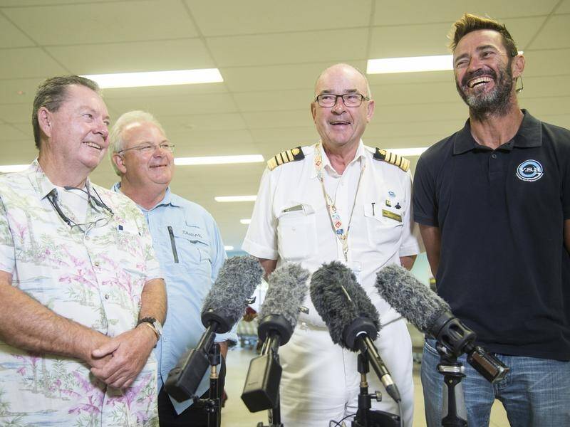 Captain Alan Dockeray's(2nd right) ship rescued the sailors after their boat sank near New Caledonia
