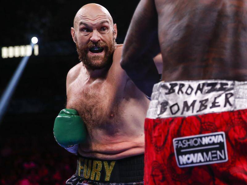 Boxing great Mike Tyson has urged Tyson Fury (pic) to continue fighting amid rumours he may retire.