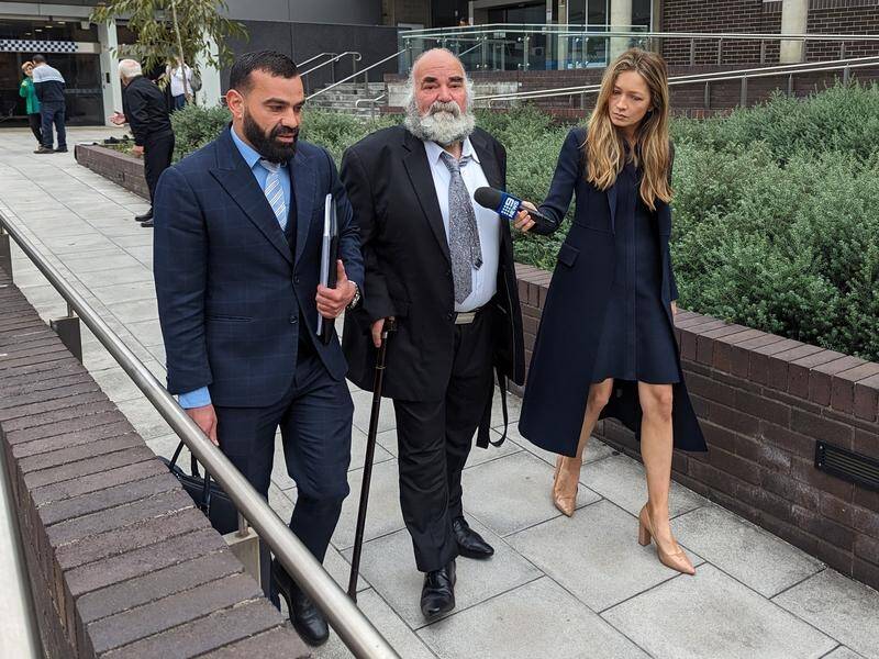 Kagadour Kokozian (centre) is accused of covering up his son's alleged offending. (Miklos Bolza/AAP PHOTOS)