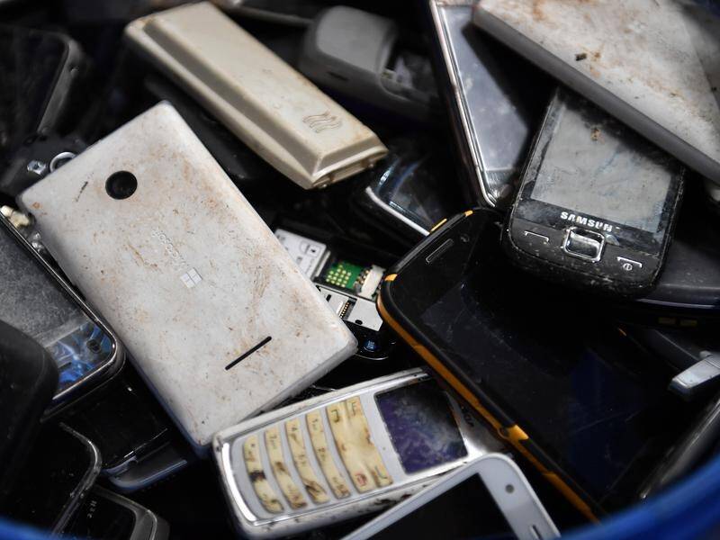 Thousands of tonnes of old phones and other devices from workplaces are disposed of every year. (Joel Carrett/AAP PHOTOS)
