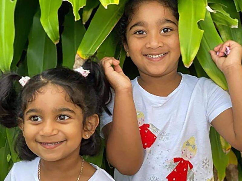 Kopika (right) and Tharnicaa, the daughters of the Biloela Tamil family, will be reunited soon.
